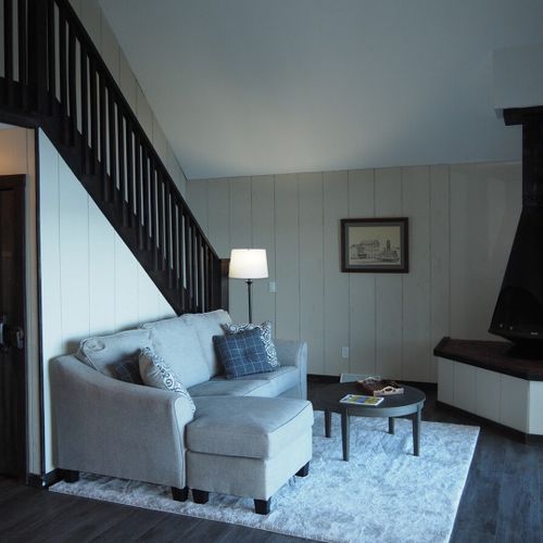 Living room:  the cottage has a cozy living room with a great view of bass lake. Includes live-streaming television with hulu, hbo max, pureflix, netflix, and disney+. (guests are not permitted to use the wood fireplace. )