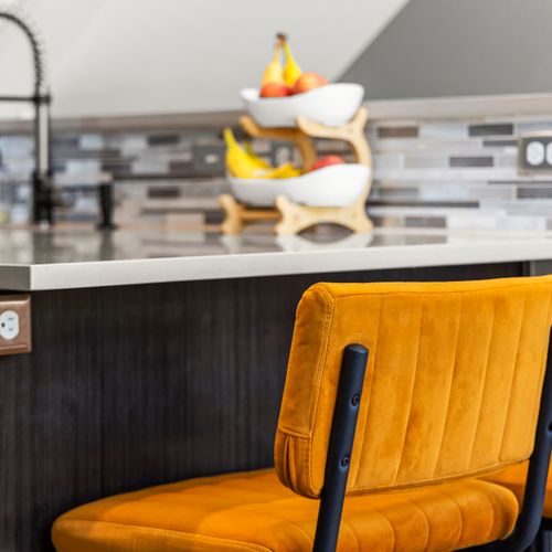 Cozy seating with soft textures creating an inviting, comfortable place to unwind