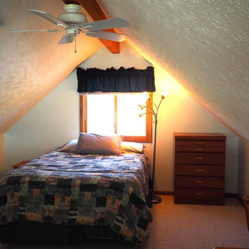 Loft:  there is a large loft area with a full-size bed, dresser, loveseat, chairs, and table.