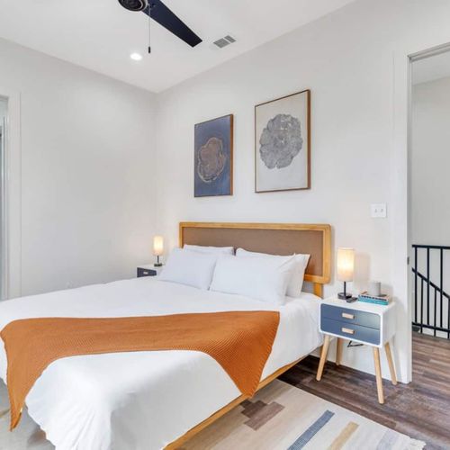 Upstairs king bedroom w/ en-suite bath — bright, warm & private.