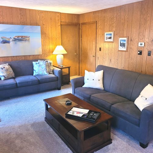 LIVING ROOM:  The large and beautiful living room with walk-out to the bonfire ring.  (Note that the fireplace is not available for guest usage.)