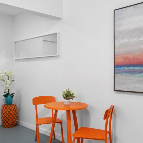 Bright and cozy living space with a vibrant touch.