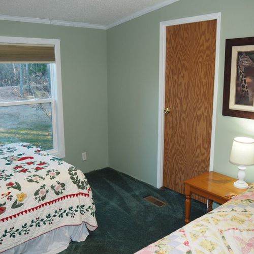 Bedroom #2:  this bedroom features 2 full-size beds, nightstands with lamps, and a nice large closet.