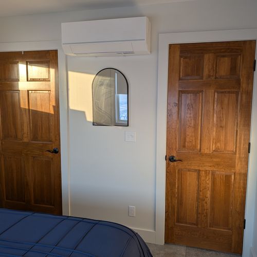 BEDROOM #1 (MAIN FLOOR):  Features a queen-size bed, ceiling fan, nightstands, nightlamps, dresser, mirror, private television, closet, and a great view of Crystal Lake!