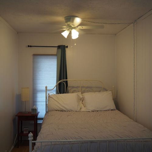 Bedroom:  the bedroom is small, but comfy and cozy, with a super comfortable pillow-top queen-size bed, nightstand, dresser, lamp, ceiling fan, and closet.