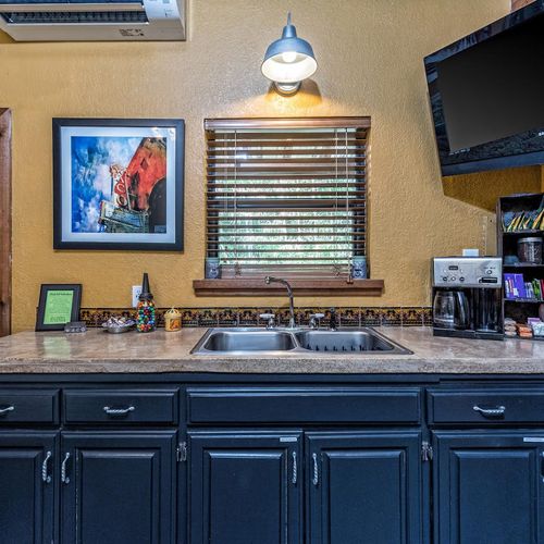 Sink, Coffee Pot with Coffee provided, toaster oven  fridge/freezer and microwave