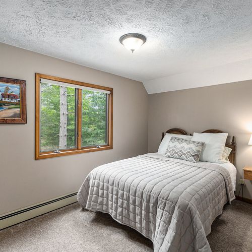 BEDROOM #3 (SECOND FLOOR):  Comfy bed with a queen-size bed, nightstand, and closet.