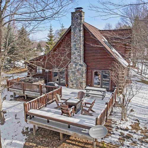 Exterior:   an aerial photo of the huge backyard deck in winter.