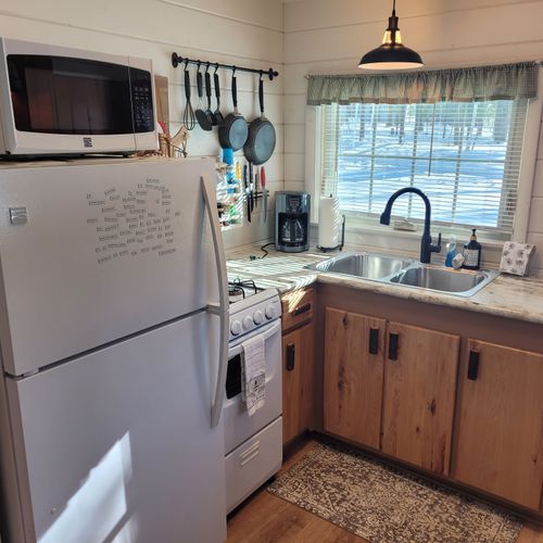 Kitchen:  the cabin has a cute little kitchen with all appliances except for a dishwasher. Includes a good supply of cooking and dining utensils as well.