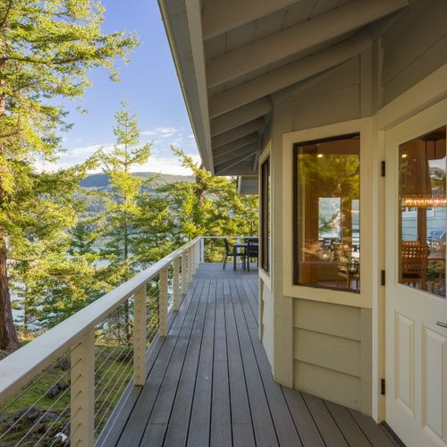 Wrap-around porch allows for side entrance to the kitchen, breakfast nook and outdoor dining.