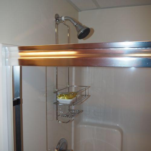 Bathroom:  full bathroom with a walk-in shower as well as a stacked washer and dryer.