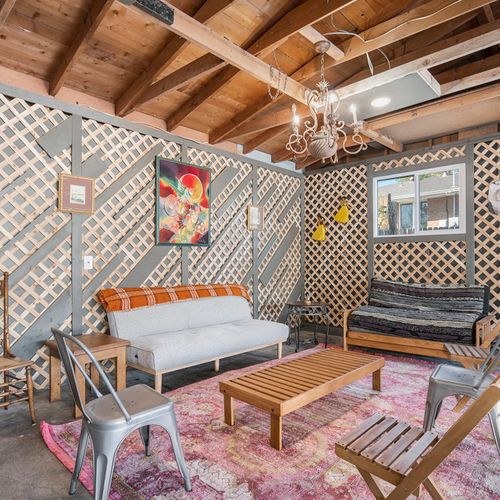 The transformed garage has become a stylish lounge featuring a pool table, ideal for entertaining and socializing.