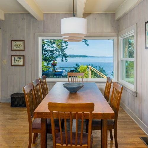 elegant indoor dining for eight or more with a large, beautiful dining table.