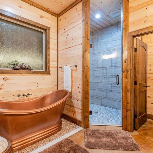 An oversized soaking tub in the private Master bath.