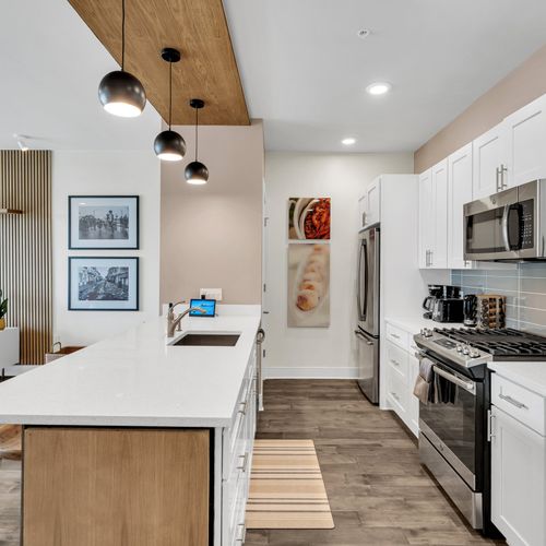 Spacious kitchen with top-of-the-line appliances and elegant design.