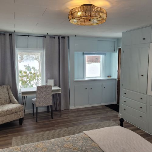 Bedroom #1:  bedroom #1 is the primary bedroom. It features a queen-size bed, ceiling fan, live streaming television, nightstands, lamps, a closet, a large dresser, a desk, and a comfy chair. There is also a door from the bedroom to the garage. (the door is fully lockable. )