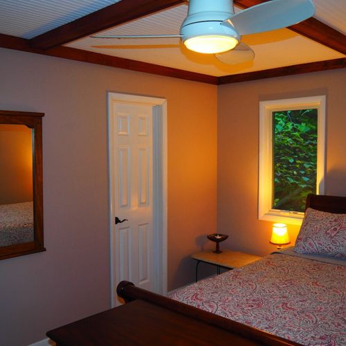 Bedroom #1 (second floor):  features a queen-size bed, nightstands, dresser, ceiling fan, closet, and a private entrance to the second floor bathroom.