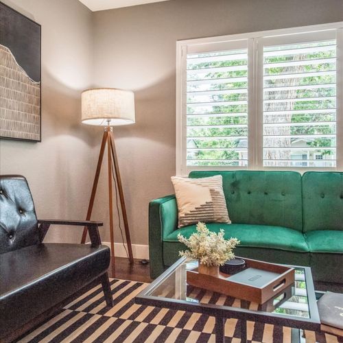 Gather with friends and family in our comfortable velvet couch and leather accent chairs.
