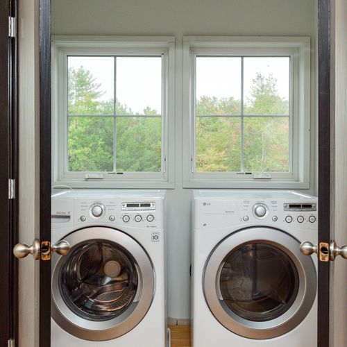 Washer & Dryer with views of the backyard.