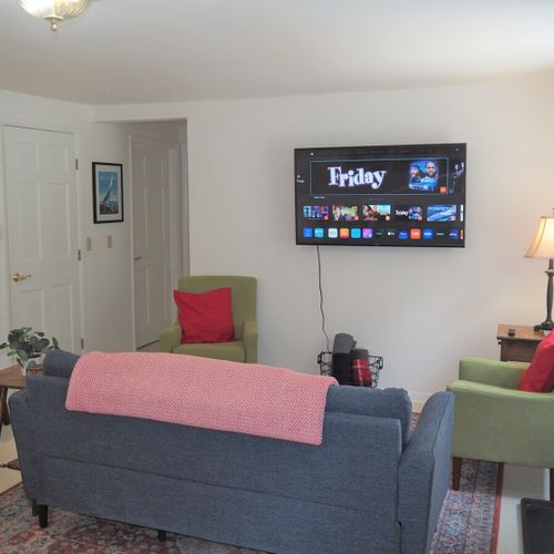 Living room:  very comfy living room with a large television with live streaming.