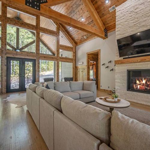 Oversized sectional around the tv and stone fireplace!