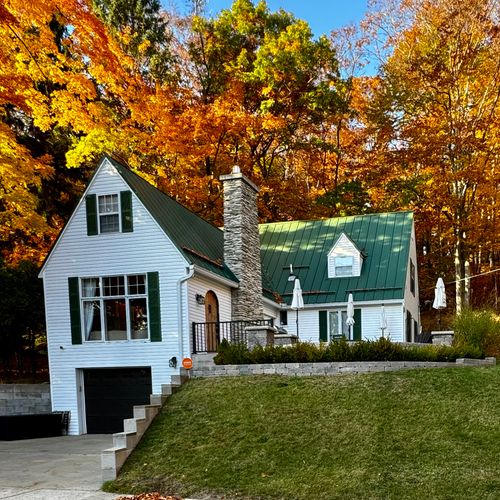 EXTERIOR:  Looking at the home from the street in the fall.