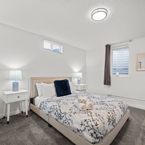 Comfortable queen bedroom fully equipped for deep night rest and relaxation.