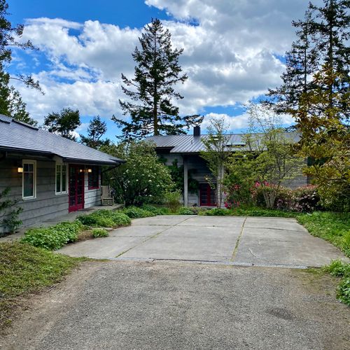 Parking area inside the gate for two cars.  There are two other parking areas just outside the gate by the garage.