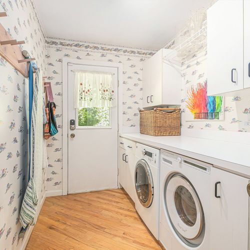 LAUNDRY ROOM:  The home has a large laundry room with a front load washer and dryer.