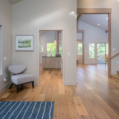 The main entry leads to the open dining and kitchen area.