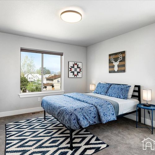 Take in the stunning westerly views of the stunning rocky mountains from this bright and cheery bedroom.