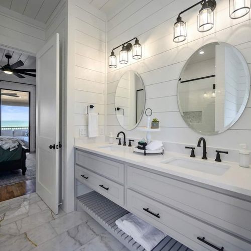 Attached private bathroom with double vanity.
