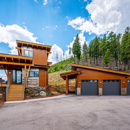 Paved driveway with spawling parking space as well as a 3-car detached garage.