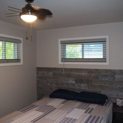 Bedroom #2:  also features a queen-size bed, ceiling fan, and closet.