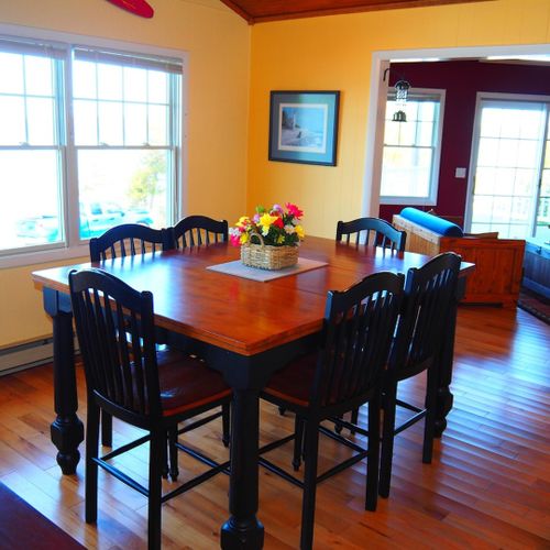 Dining area:  there is a lovely dining area with a table and chairs for up to 6 adults. It is located between the kitchen and the living room.