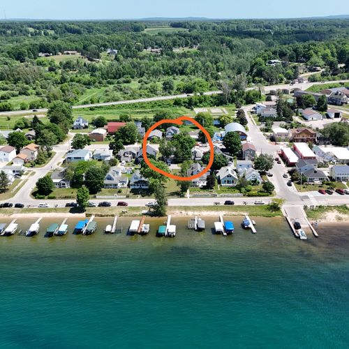 EXTERIOR:  Aerial photo from over Crystal Lake looking back at the house with the public boat launch and public fishing pier both visible.