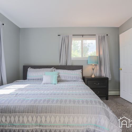 Sinking into a peaceful slumber in our chic bedroom, complete with soft bedding and plenty of closet space.