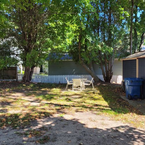 EXTERIOR:  The backyard, which includes outdoor dining