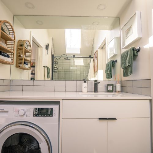 Plenty of counter space over the washer/dryer in the bathroom