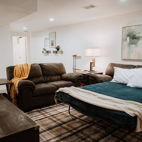 - turn downtime into dream time with a comfy pull out sofa bed for extra guests
- soft lighting, layered blankets, and calming décor create a snug sleep nook
- perfect for kids, extra family, or a netflix and nap kind of night