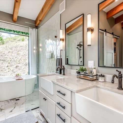 Gorgeous ensuite bathroom with spa-inspired finishes, deep soaking tub and euro-style shower featuring private views.