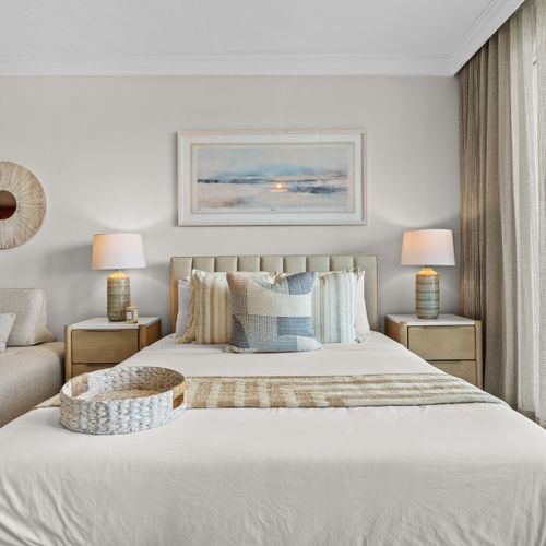 Plush queen bed in a beautifully decorated room. Your serene escape await
