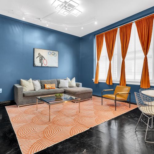 Bright, open, and stylish—this modern living and dining space is perfect for relaxing or enjoying a meal, all while surrounded by the vibrant colors and unique design that capture the essence of New Orleans.