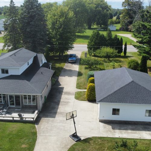 Overall:  aerial view of the larger house on the hill. (the building on the right is a detached garage that is not available for guest usage. )