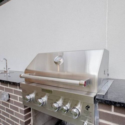 Stainless steel BBQ grill on-site — fire it up for an outdoor cookout.