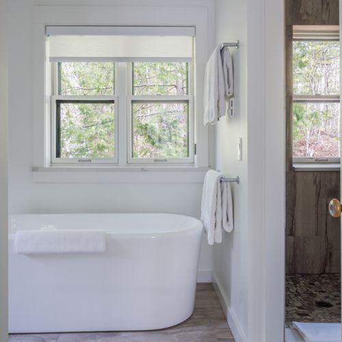 Full bathroom, complete with both bath and shower, adjacent to the primary bedroom on this private level.