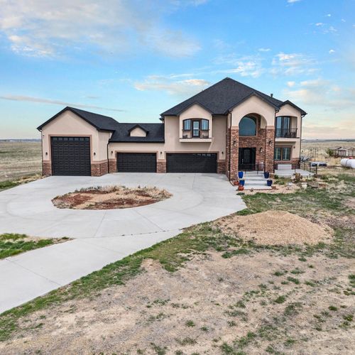 Grand exterior with crisp lines and modern villa-style charm.