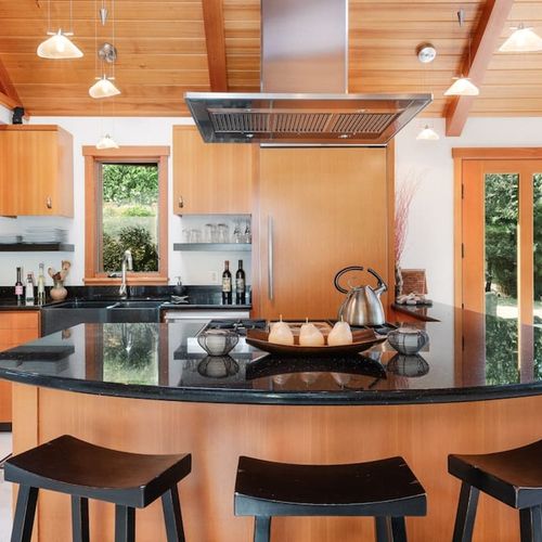 Gourmet Kitchen with coffee bar, drip coffee maker, french press, coffee grinder, toaster, microwave, and kitchen essentials.