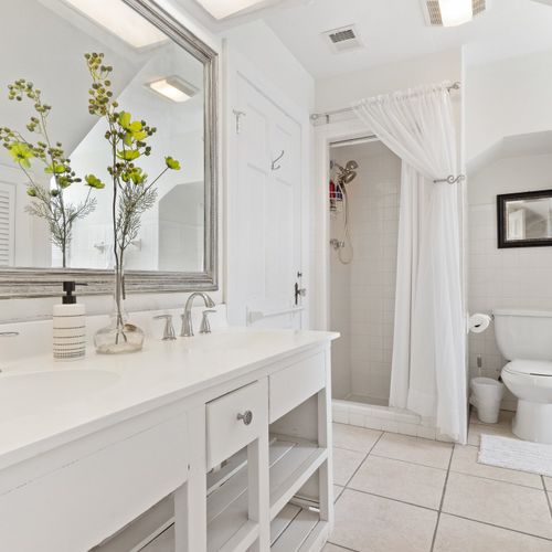 Master ensuite large bathroom with walk-in closet to the left | Upstairs