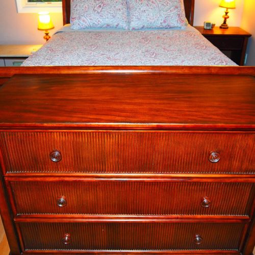 Bedroom #1 (second floor):  features a queen-size bed, nightstands, dresser, ceiling fan, closet, and a private entrance to the second floor bathroom.